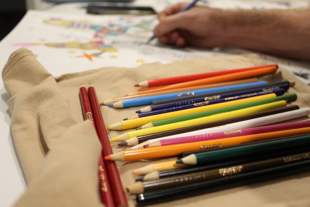 a group of pencils sitting on top of a table