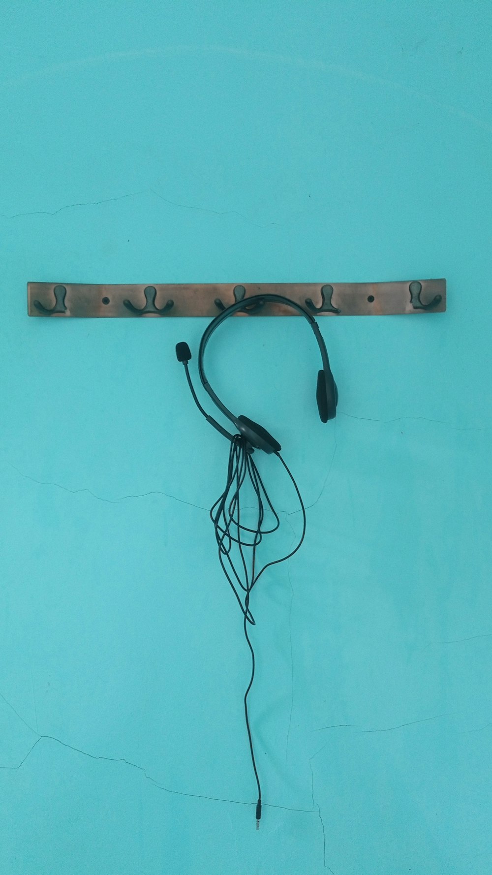 a wall mounted electrical device with wires attached to it