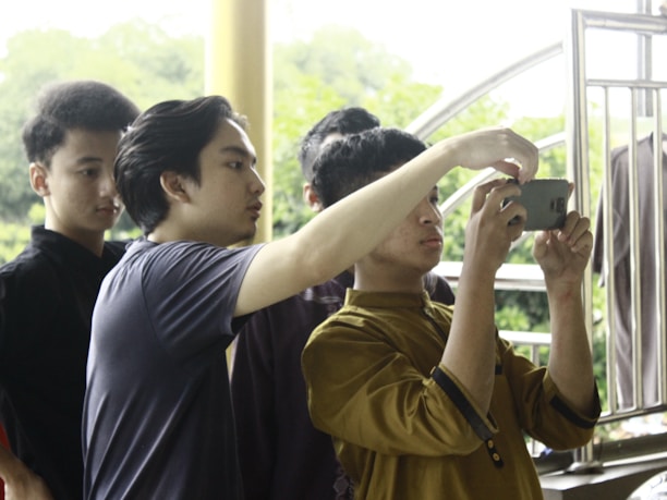 A group of people participating in a survey using the vote&go app.