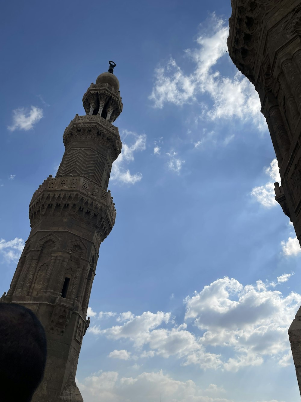 a tall tower with a clock on the top of it