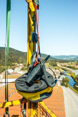 a pair of skis hanging from the side of a lift