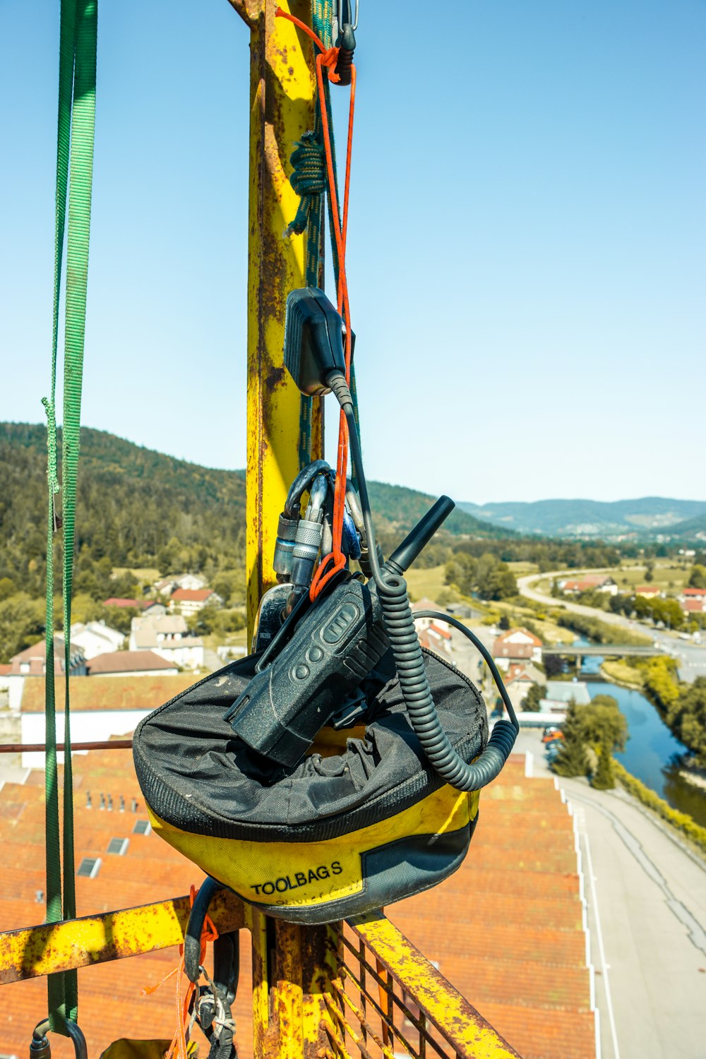 a pair of skis hanging from the side of a lift