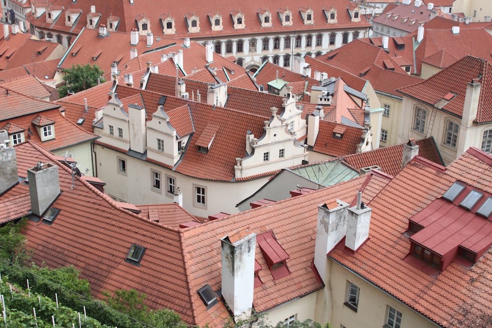 a group of buildings with red roofs in a city