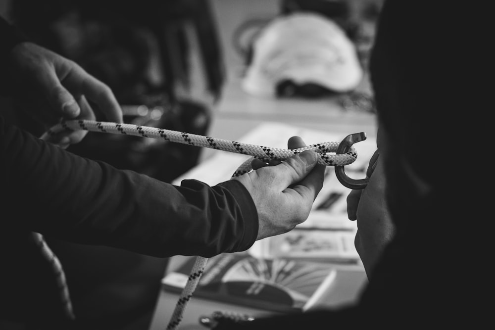 a couple of people that are holding scissors