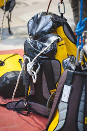Rope bags with climbing rope and karabiners