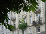 Elegant building facade with greenery in front, typical of Lima neighborhoods