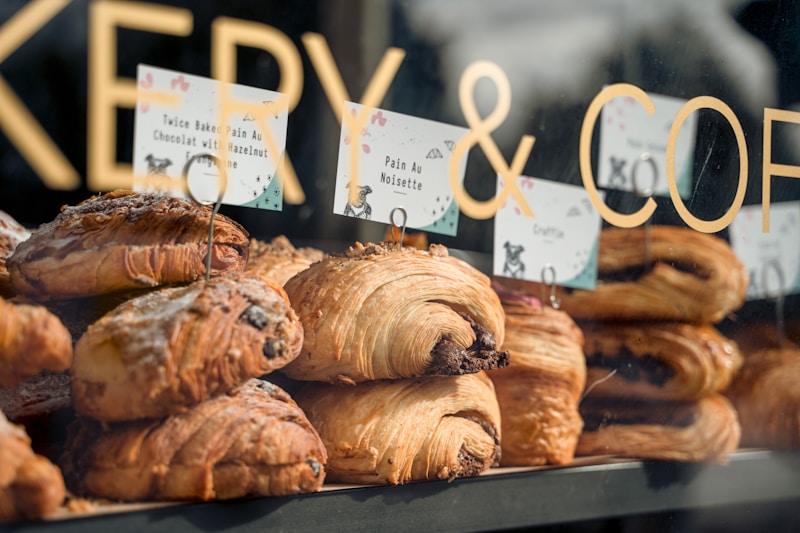 a display of pastries in a bakery window