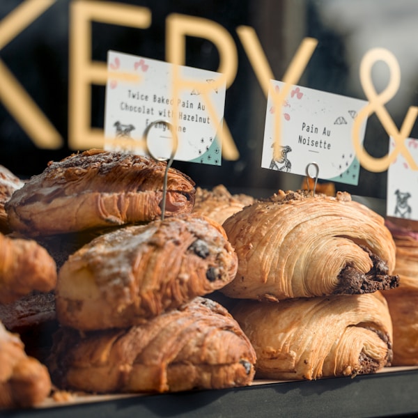 a display of pastries in a bakery window