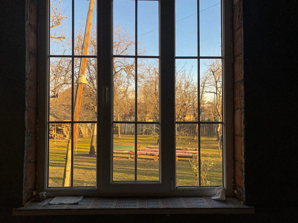Large multi-pane window set in an unfinished construction wall