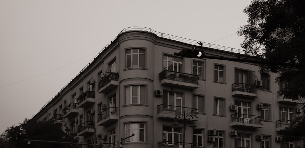 a black and white photo of an apartment building
