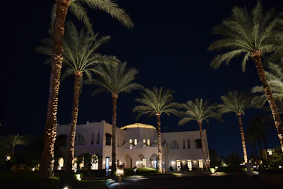 Nighttime shot of Aptos Interamericanos illuminated softly, highlighting its timeless elegance.