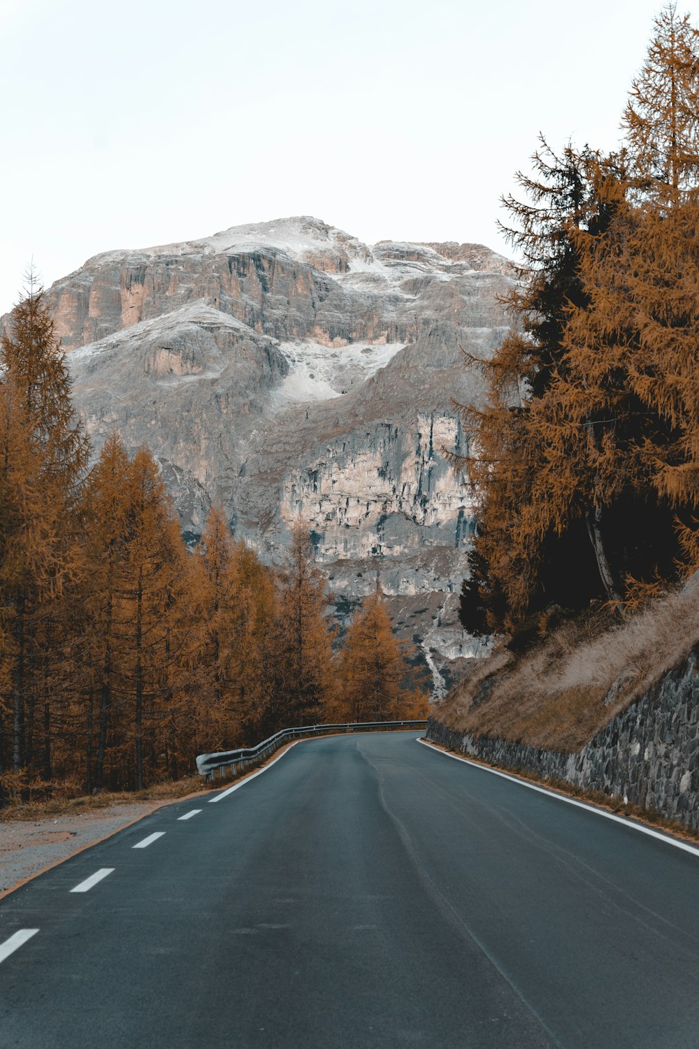 a road with a mountain in the background