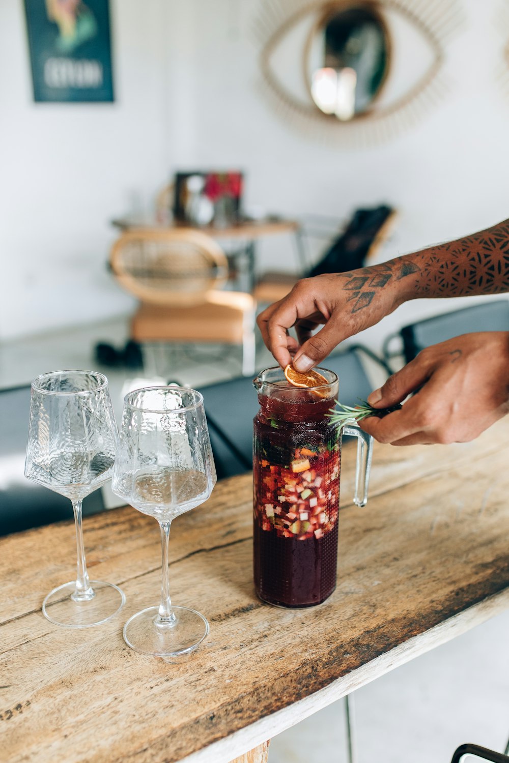 a person putting something in a jar on a table