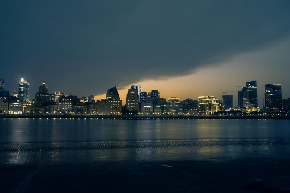 a view of a city at night from across the water