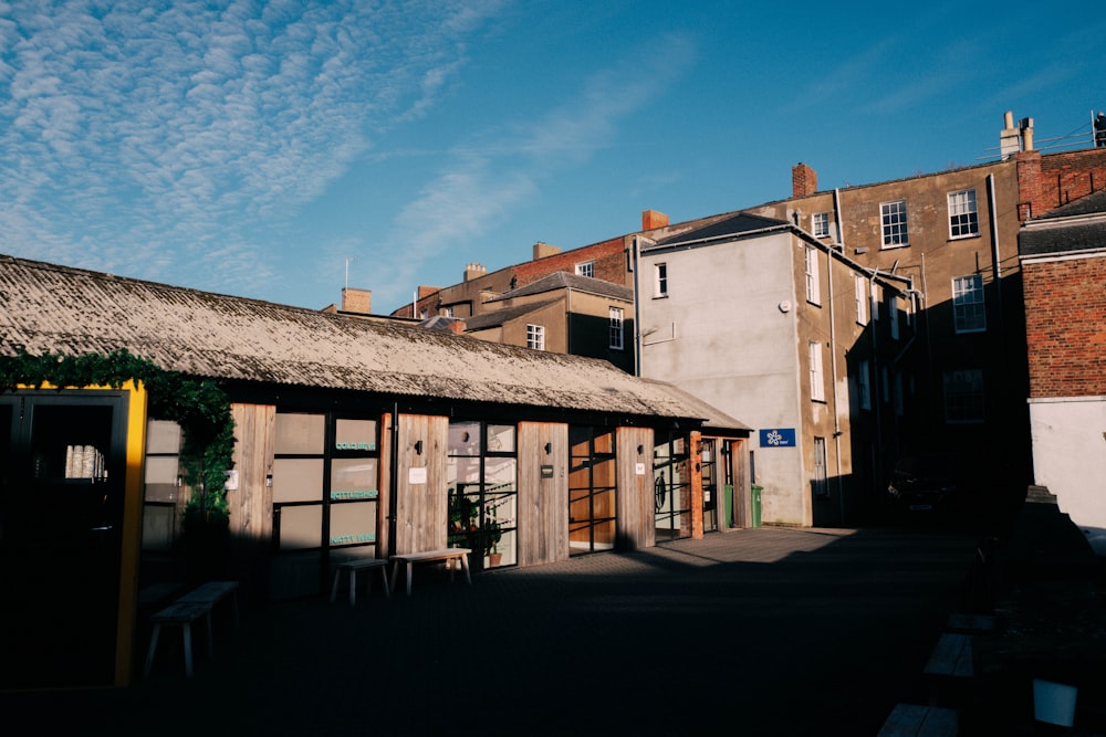 a row of buildings with a thatched roof