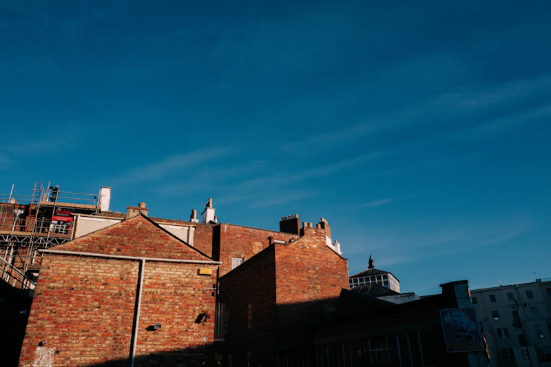 Brick residential property under refurbishment with scaffolding