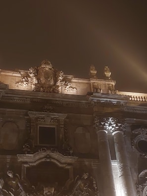 Facade lighting artfully outlining a commercial building at dusk.