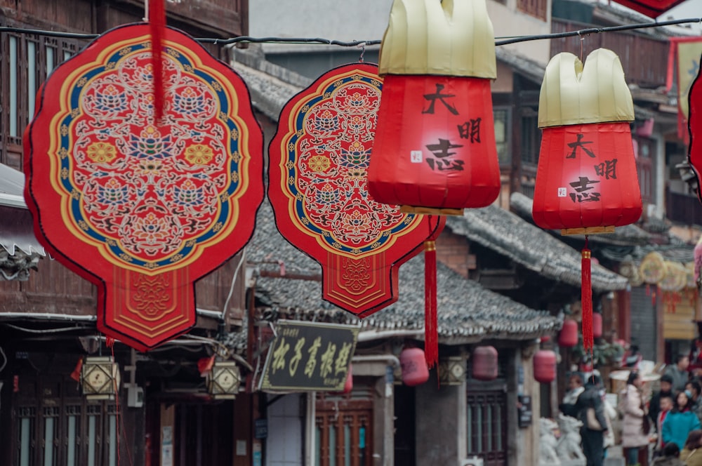 a group of red lanterns hanging from a line