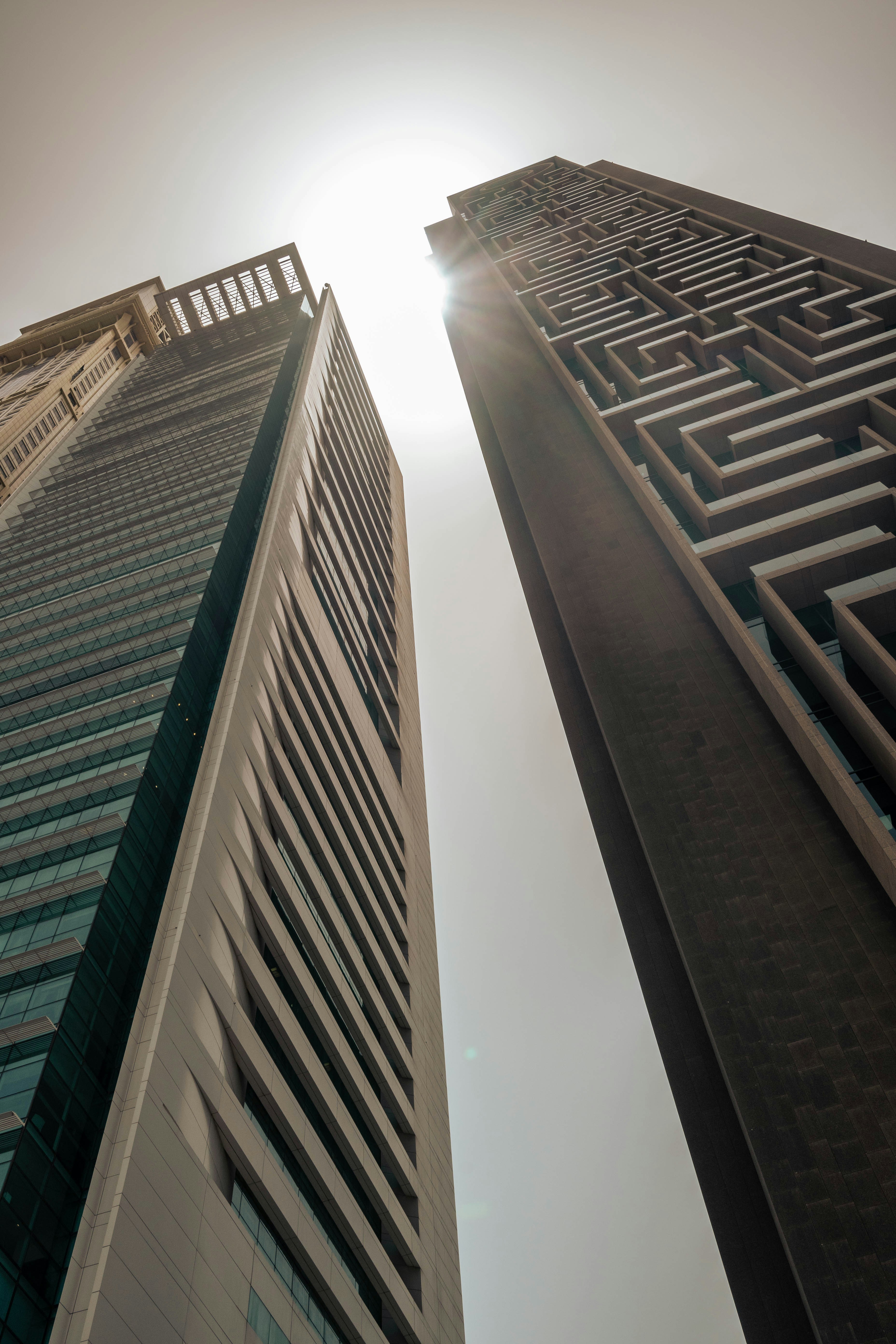 a couple of tall buildings next to each other