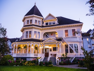 a large white house with a lot of lights on it