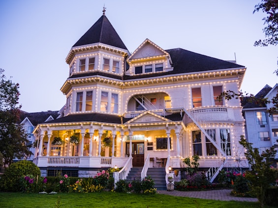 a large white house with a lot of lights on it