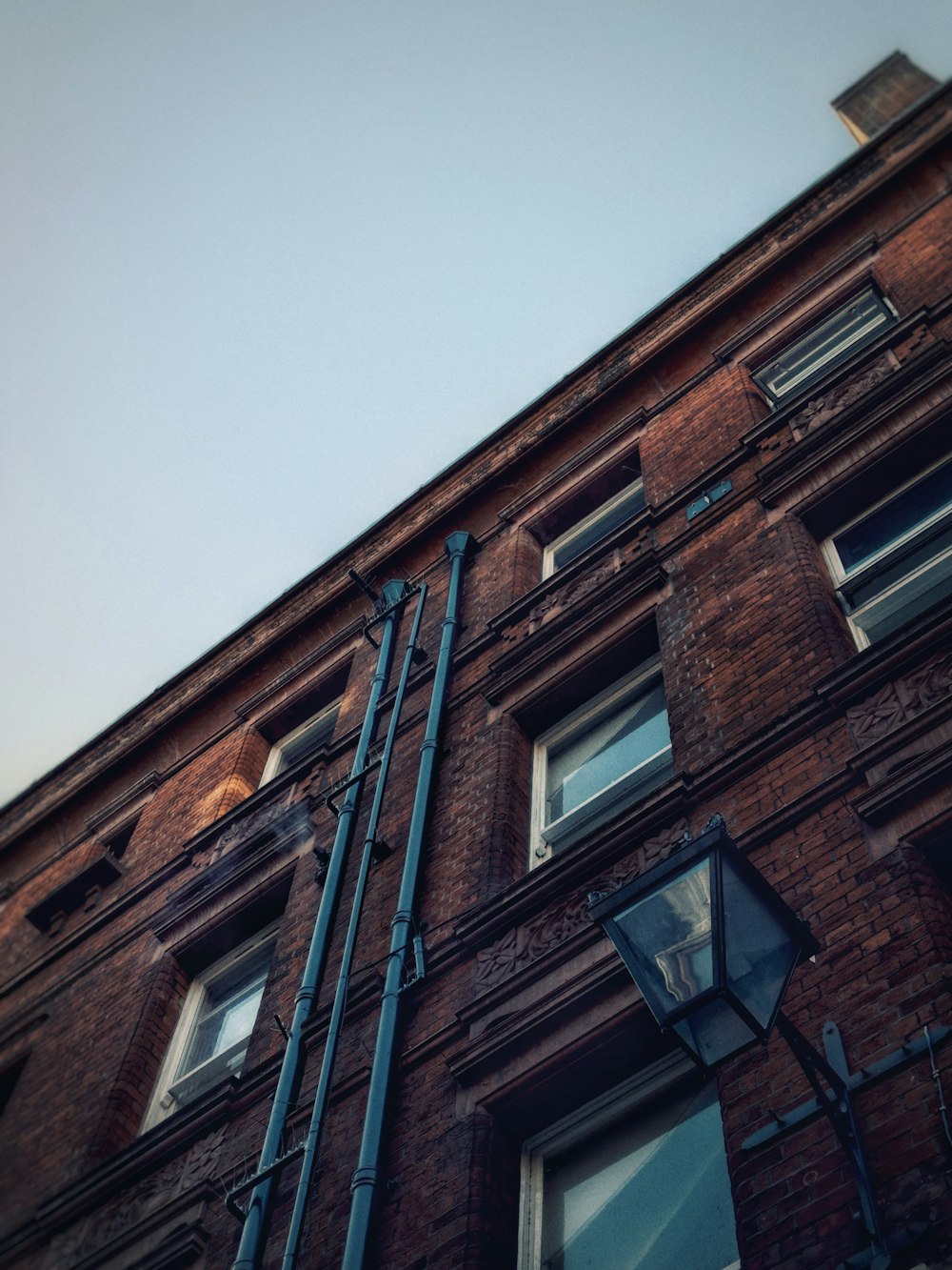 a tall brick building with lots of windows