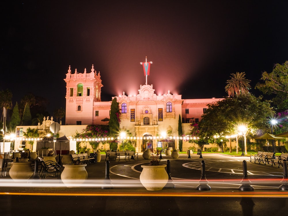 a large building with a clock tower at night