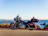 Close-up of a shiny sport motorcycle parked on a scenic mountain road.