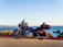 Close-up of a shiny sport motorcycle parked on a scenic mountain road.
