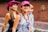 a group of young women walking down a street