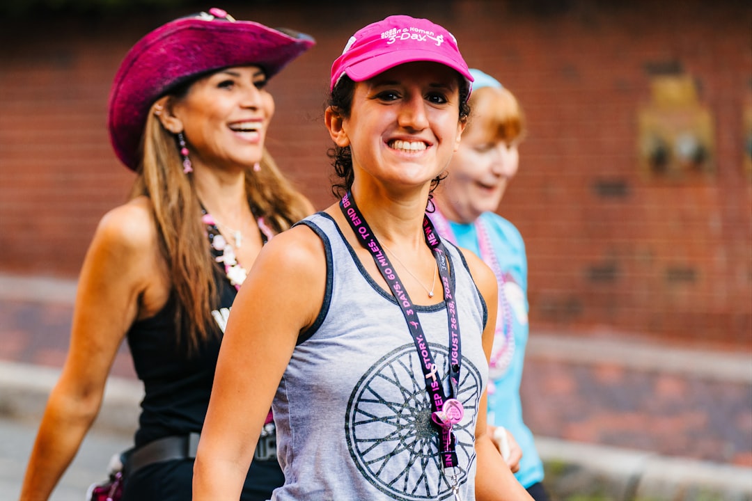a group of young women walking down a street,