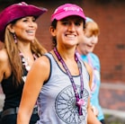 a group of young women walking down a street