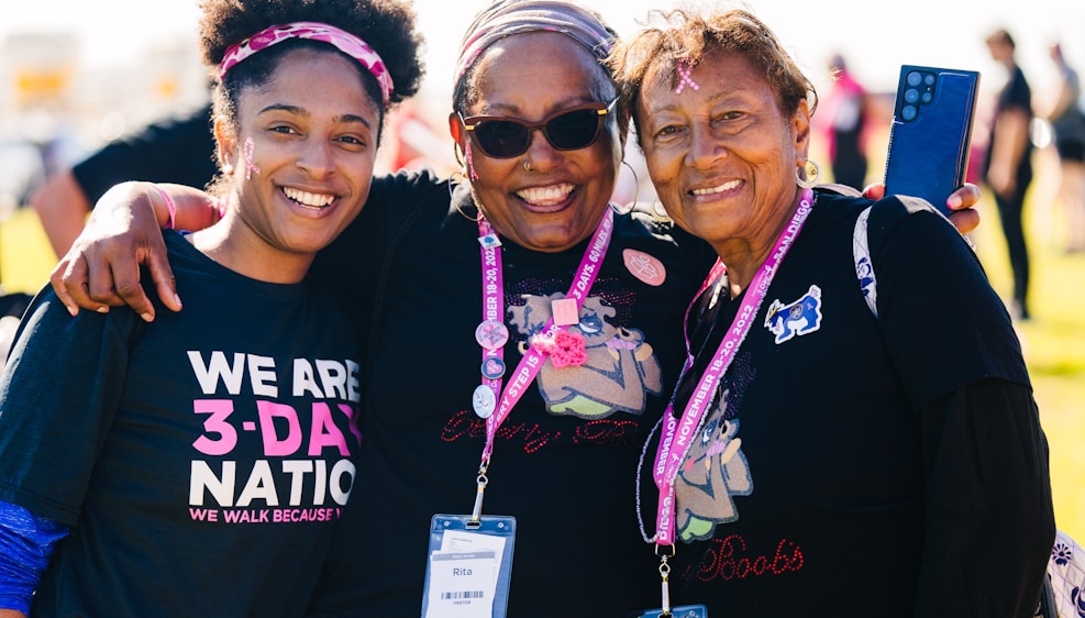 a group of women standing next to each other