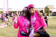 A community walk event with participants wearing foundation t-shirts and smiling.