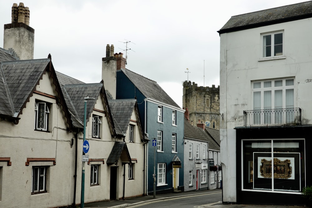 a row of houses next to each other on a street