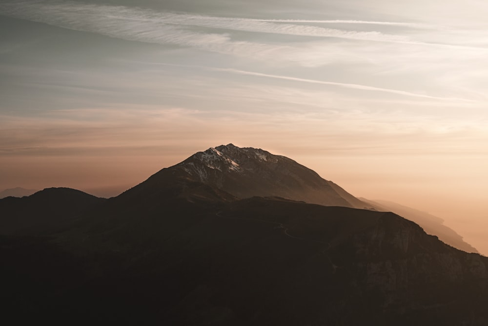 a view of a mountain with a sky background