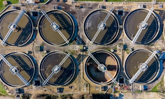 a large group of water tanks sitting next to each other