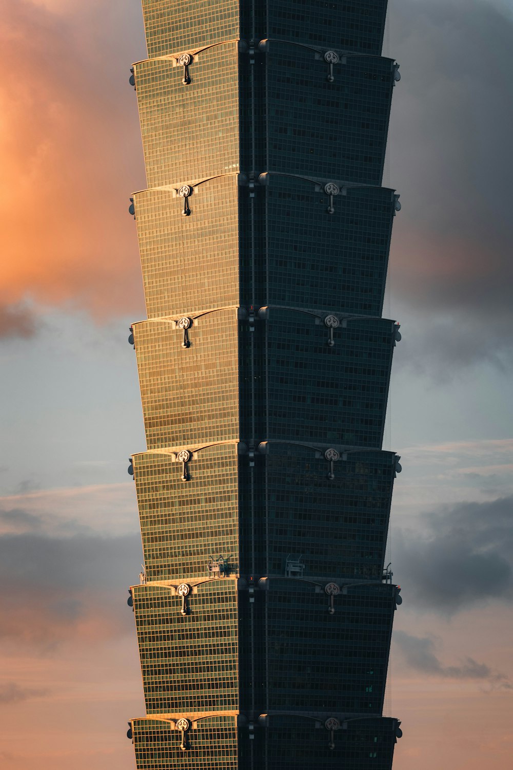 a tall building with a sky in the background