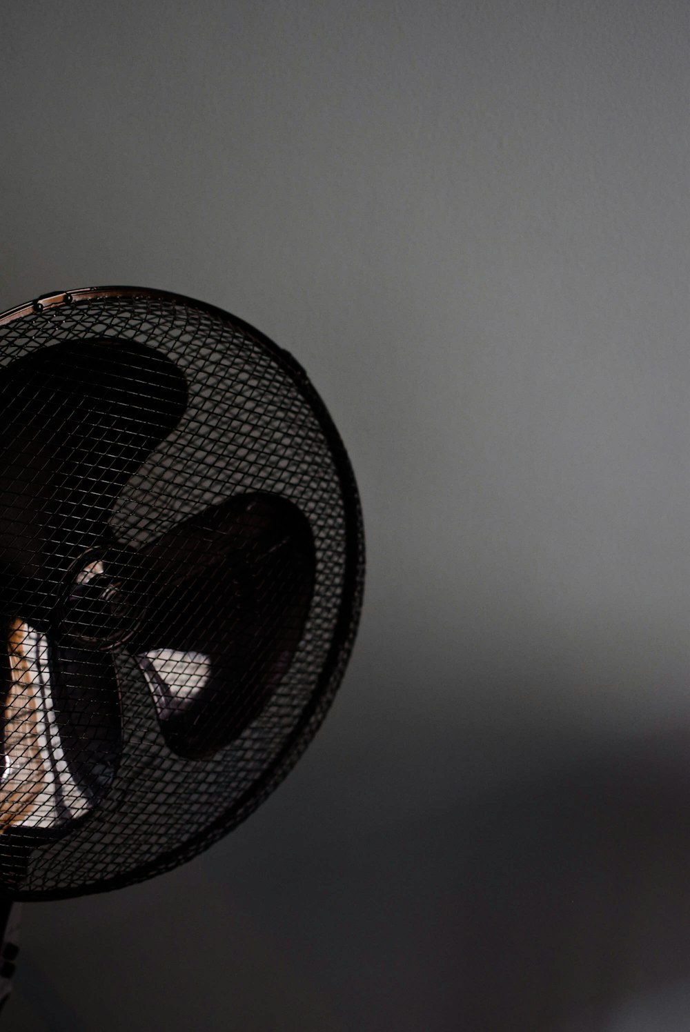 a black fan sitting on top of a table