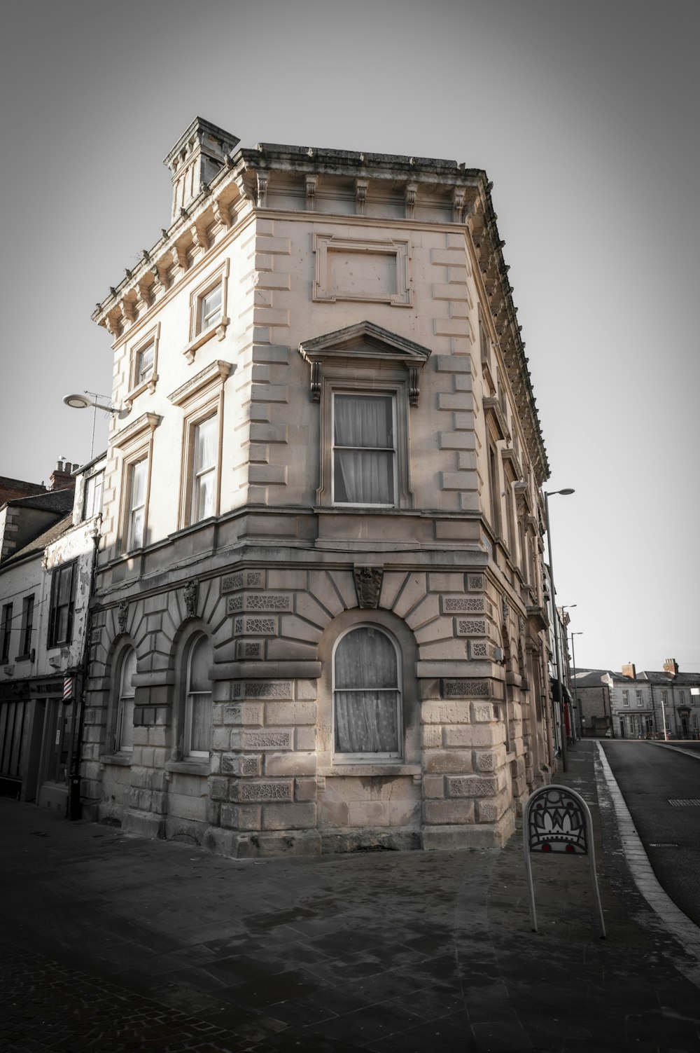 an old building with a clock on the front of it