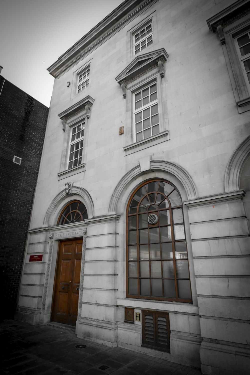 a large white building with a brown door