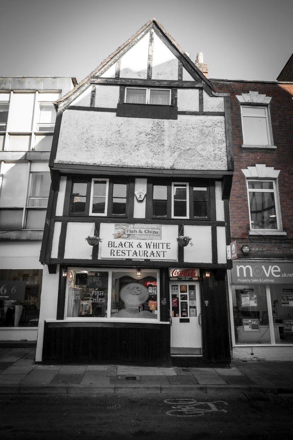 a black and white photo of a store front