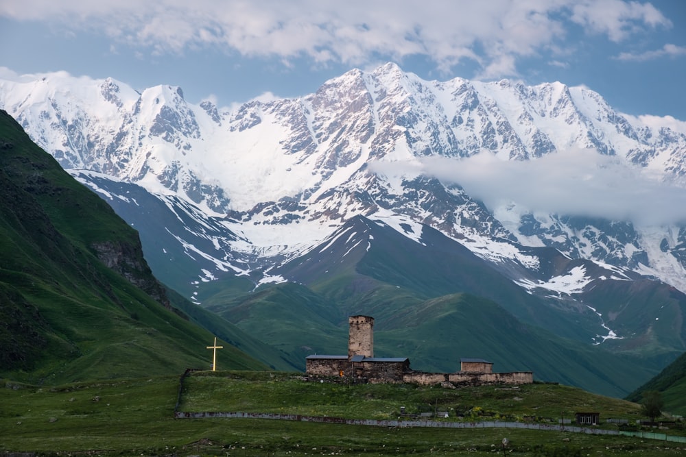 a mountain range with a church in the foreground