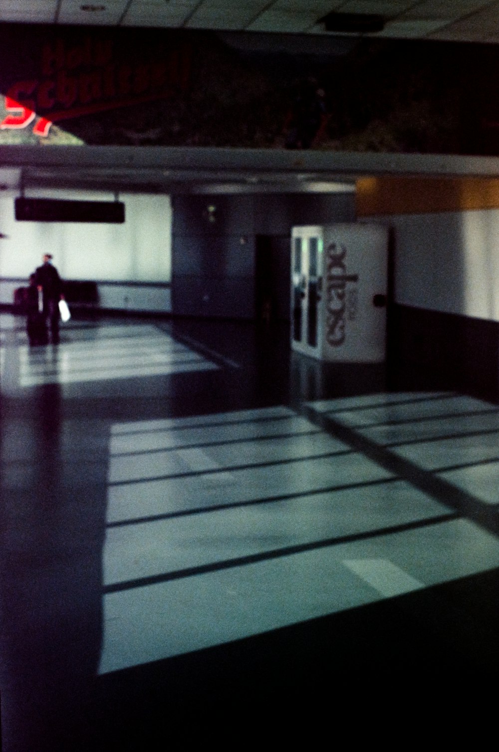 a person sitting on a bench in an airport