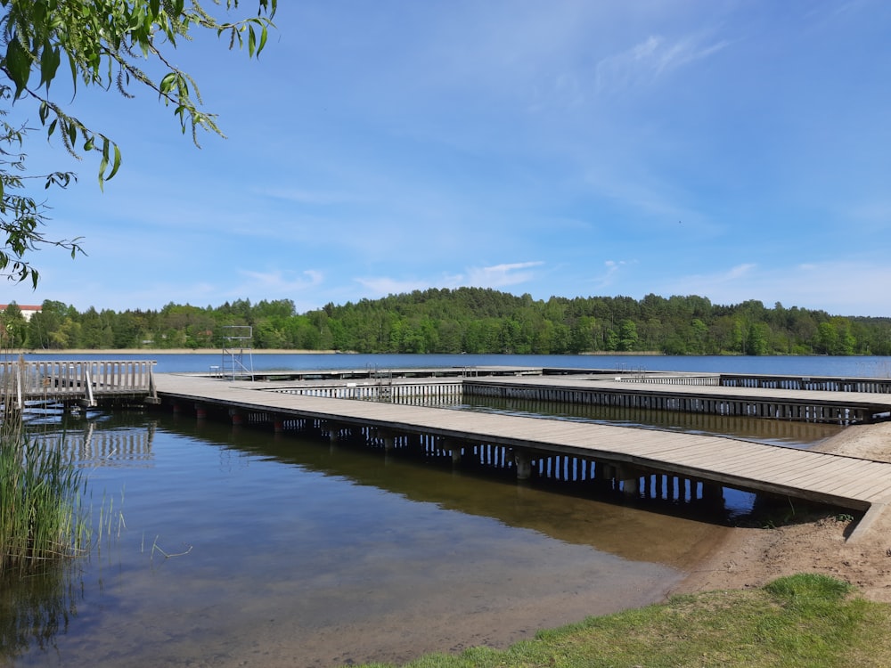 a wooden dock sitting next to a body of water