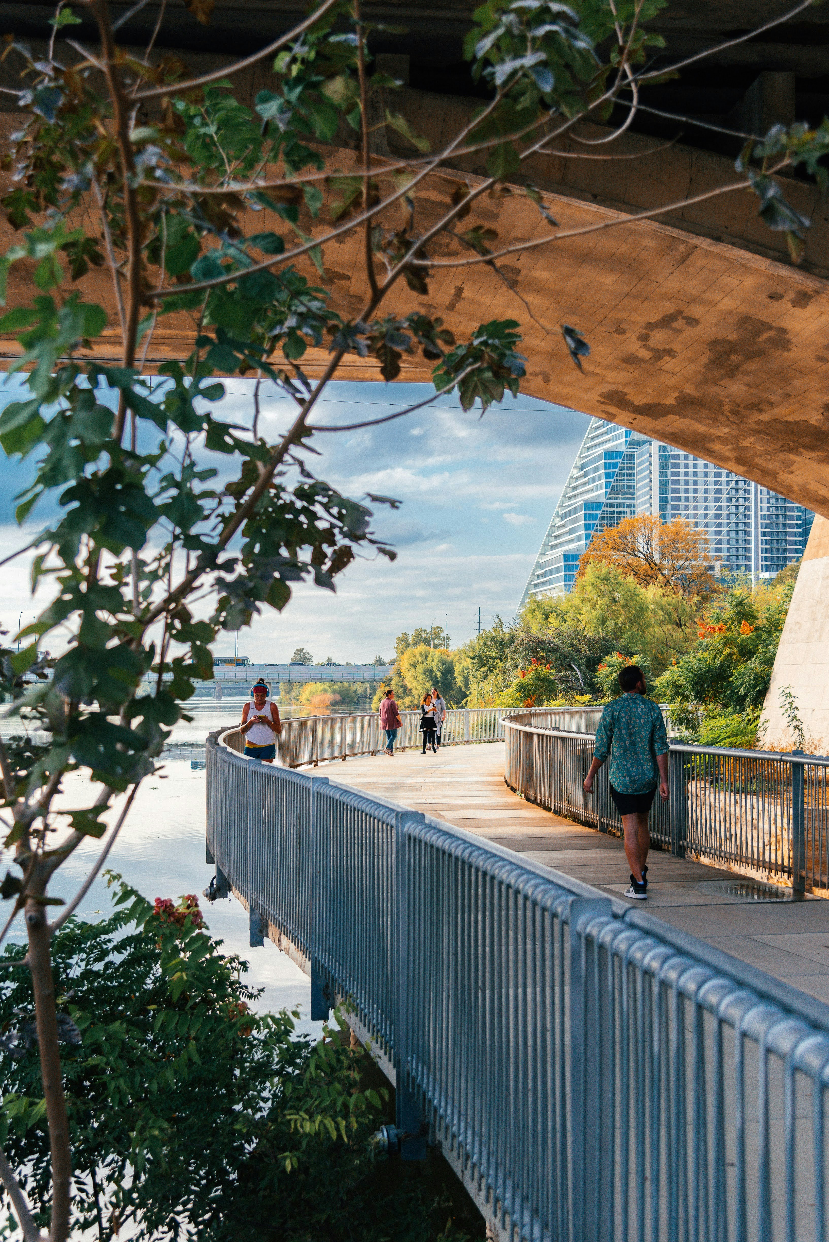 A group of people walking across a bridge photo – Free Usa Image on ...