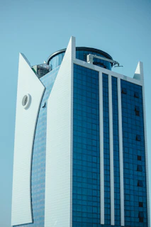 a very tall building with a clock on it's side