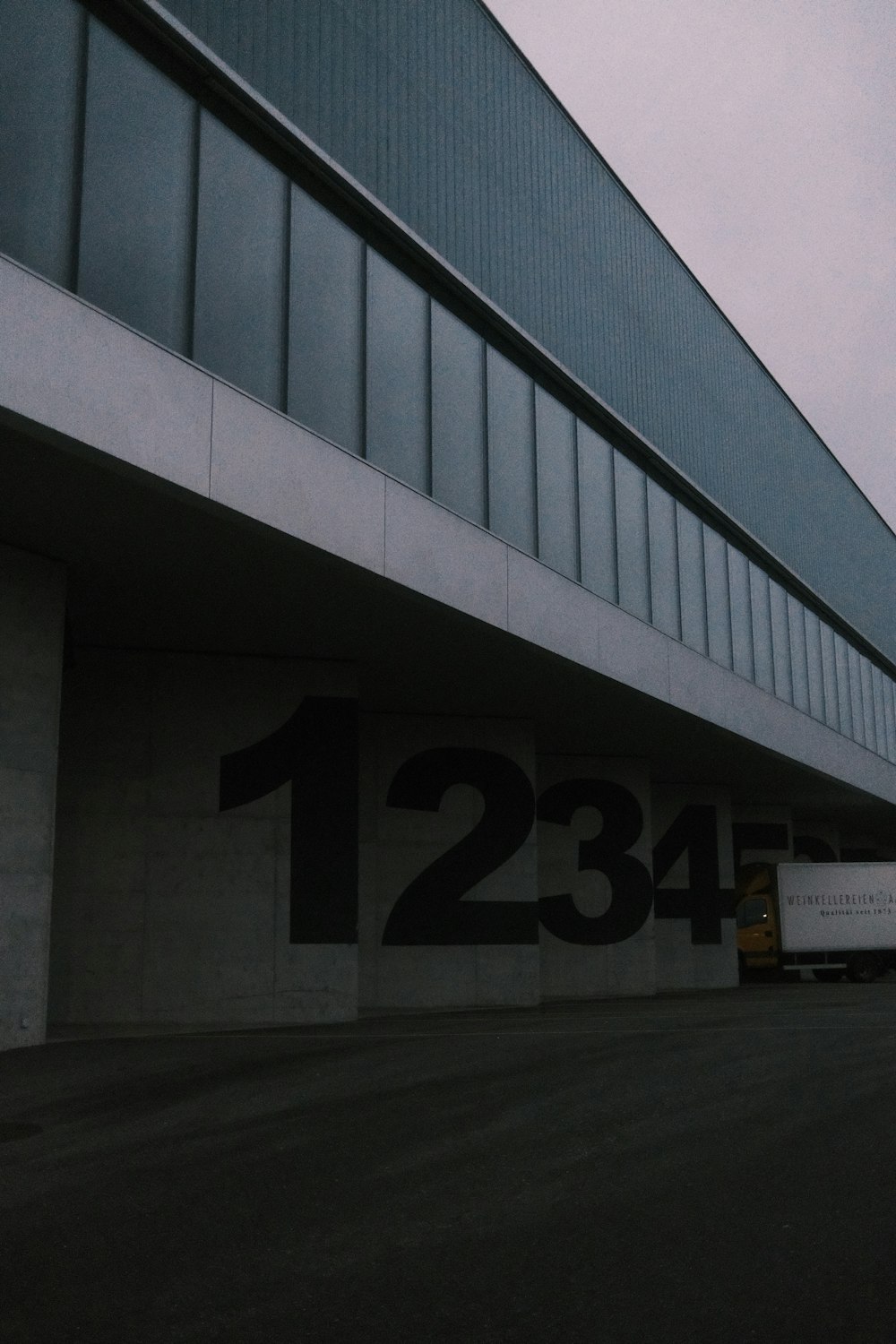 a large truck parked next to a building