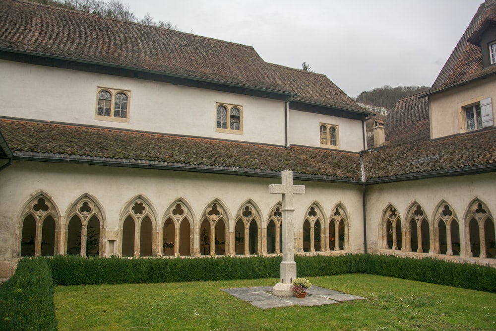 a large building with a cross in the middle of it