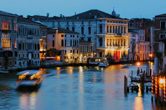 Evening lights reflecting on the canals in the lively Navigli district.